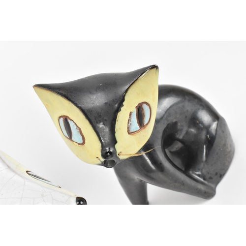 8 - A pair of mid-century ceramic cats by Leopold Anzengruber, Vienna Austria, one in black glaze, the o... 