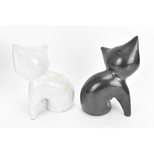 8 - A pair of mid-century ceramic cats by Leopold Anzengruber, Vienna Austria, one in black glaze, the o... 