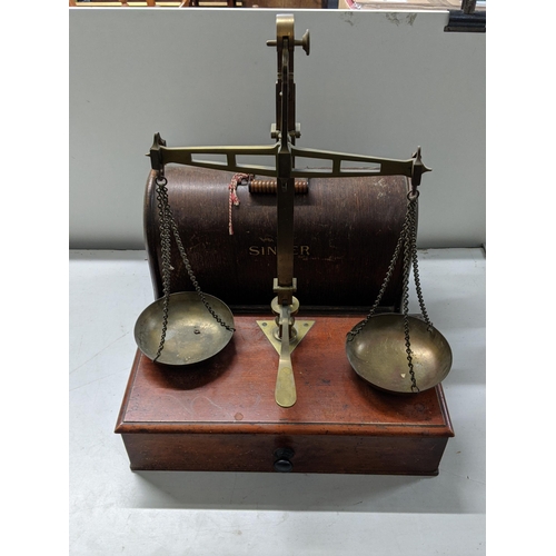 192 - A late Victorian mahogany and brass balance with a pair of pans and various sets of weights, a Singe... 