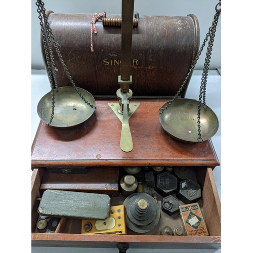 192 - A late Victorian mahogany and brass balance with a pair of pans and various sets of weights, a Singe... 