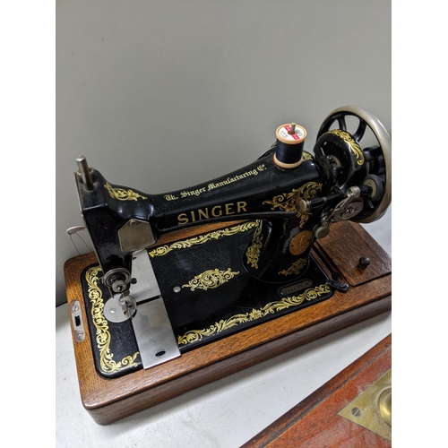 192 - A late Victorian mahogany and brass balance with a pair of pans and various sets of weights, a Singe... 