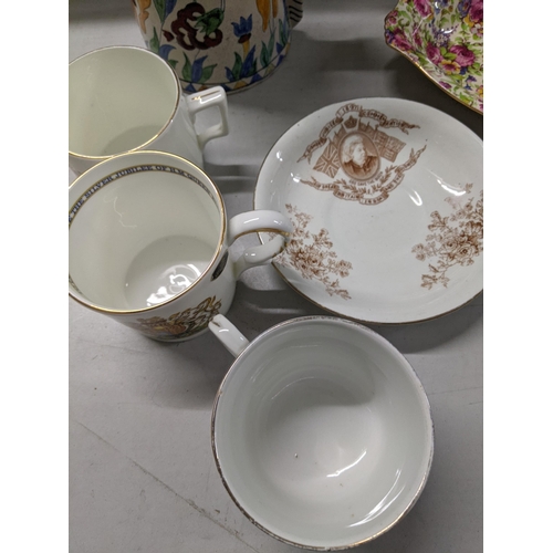 195 - Ceramics to include a Isnick vase commemorative mugs, a cup and saucer and a Winton Chinty dish
Loca... 