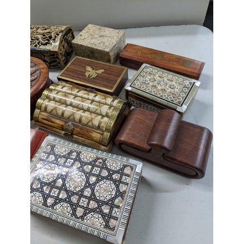 223 - A collection of mixed boxes to include a Vietnam soapstone box, camel bone boxes and others
Location... 