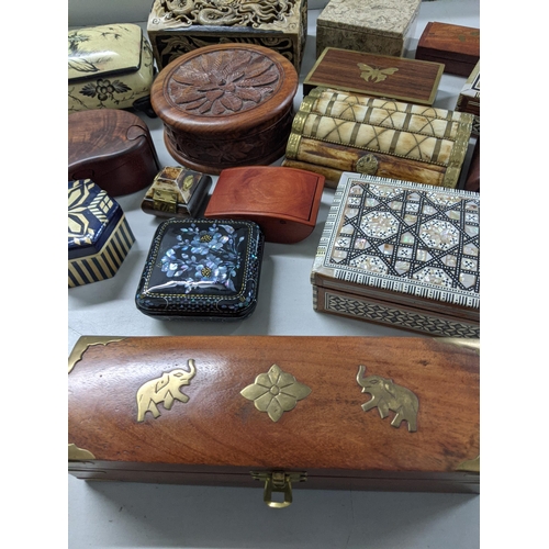 223 - A collection of mixed boxes to include a Vietnam soapstone box, camel bone boxes and others
Location... 