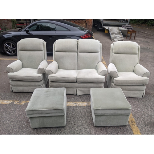 285 - A G-plan two seater sofa in faded green, two armchairs and a pair of matching footstools
Location:RE... 