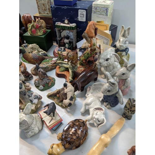 332 - A mixed lot to include Brambly Hedges border fine arts, a soap stone owl, porcelain rabbits, treen c... 