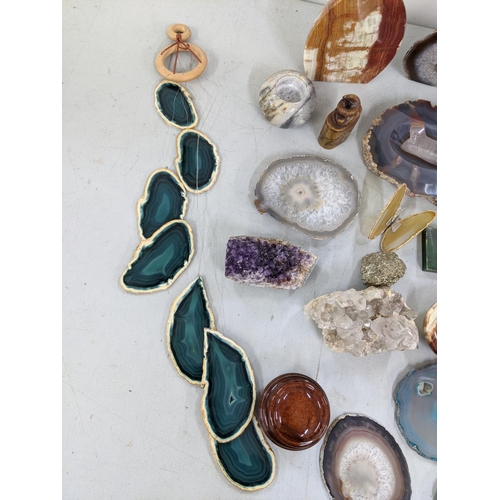 355 - A mixed lot to include a small amethyst crystal cluster, a pyrite crystal, agate wind chime, agate b... 