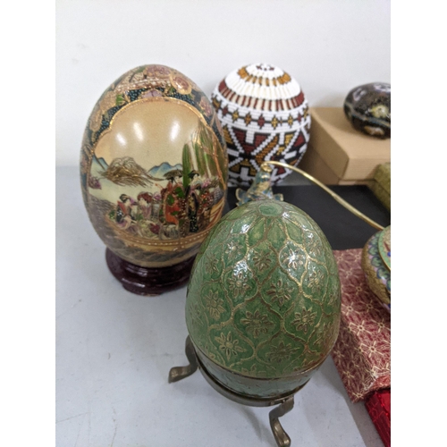 356 - A mixed lot of Oriental items to include Chinese worry balls, cloisonne, bell trinket boxes, ducks a... 