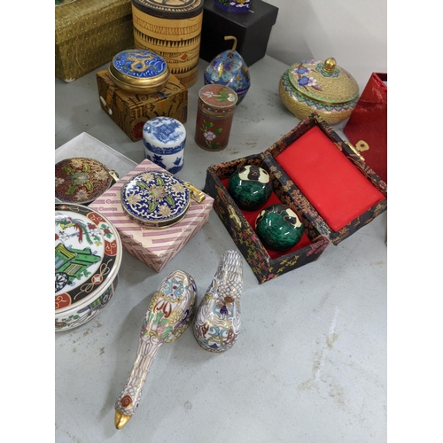 356 - A mixed lot of Oriental items to include Chinese worry balls, cloisonne, bell trinket boxes, ducks a... 