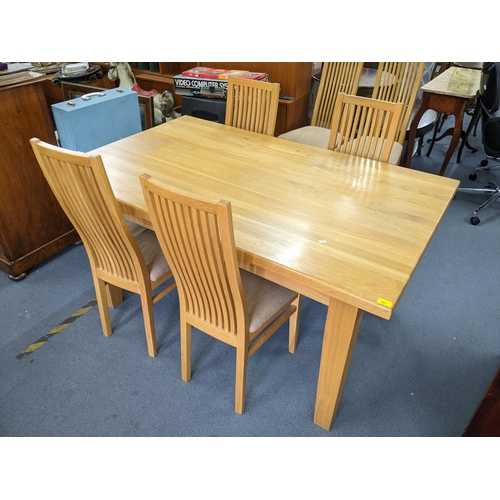 347 - A modern light oak rectangular kitchen table, 78cm h x 153cm w, together with six matching chairs
Lo... 