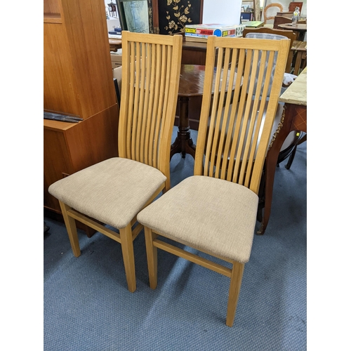 347 - A modern light oak rectangular kitchen table, 78cm h x 153cm w, together with six matching chairs
Lo... 