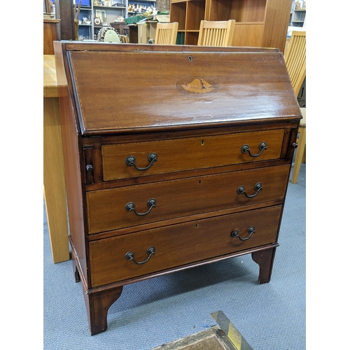 348 - An Edwardian mahogany bureau having a fall flap above three long drawers
Location:STAIRS