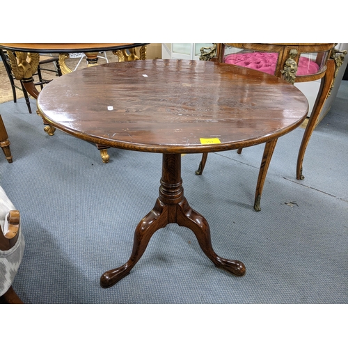 351 - A Georgian oak snap top table on three cabriole legs, 71cm h x 76.5cm w
Location:A4B