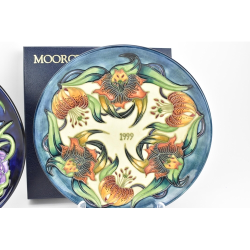 104 - A Moorcroft pottery 'Birth of Light' pattern year plate '2000', designed by Nicola Slaney and Wendy ... 