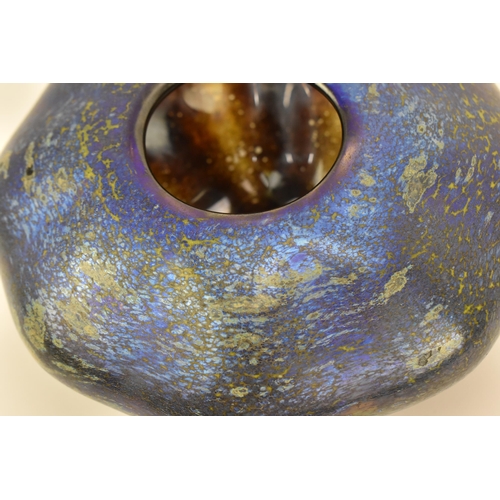 58 - An iridescent studio glass vase, of tapered octagonal form with rounded edges, mottled blue/purple g... 