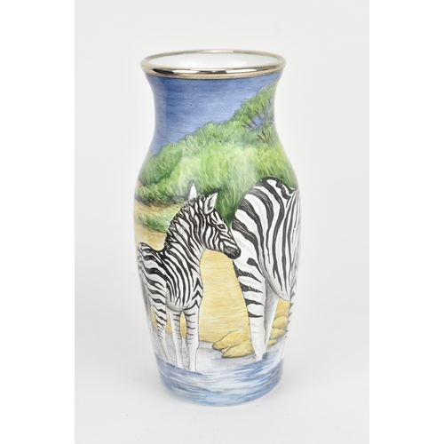 85 - A Moorcroft enamels hinged box, painted by Carol Yarnold, 2000, depicting a savanna scene with zebra... 