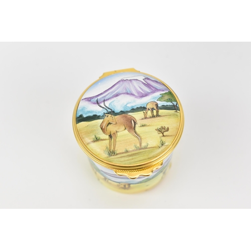 85 - A Moorcroft enamels hinged box, painted by Carol Yarnold, 2000, depicting a savanna scene with zebra... 