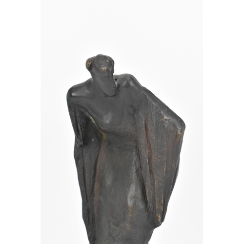 121 - A Spanish contemporary cast bronze sculpture on stone stand, modelled as a hunched figure in a flowi... 