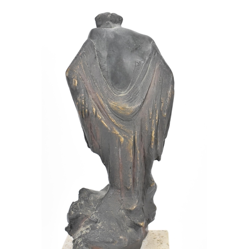 121 - A Spanish contemporary cast bronze sculpture on stone stand, modelled as a hunched figure in a flowi... 