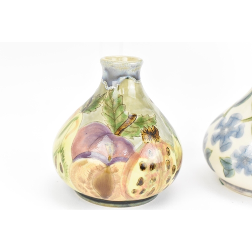 127 - A collection of five Cobridge ceramic bud vases, with various floral and fruit patterns, each with i... 