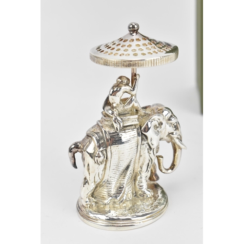 141 - A Christofle silver-plated toothpick holder, modelled as a monkey sat atop an elephant, holding an u... 