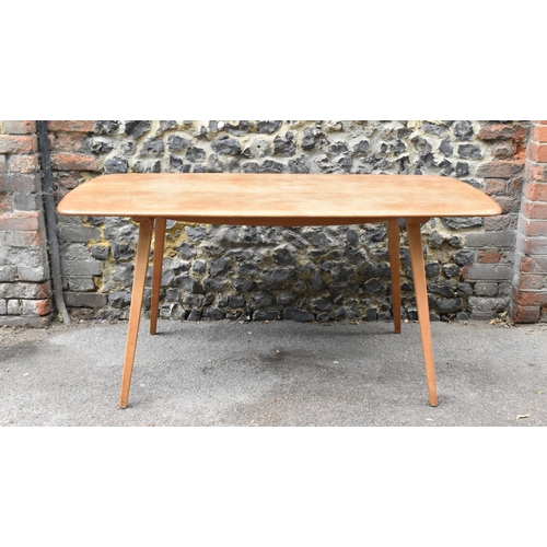 151 - A mid century light elm Ercol dining table and chairs, the table of rectangular form with tapering l... 