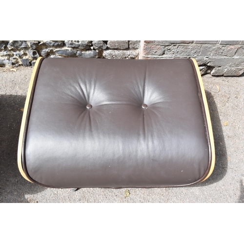 162 - A vintage brown leather armchair and ottoman, after the design by Charles and Ray Eames for Herman M... 