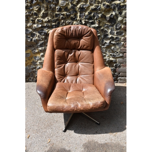 164 - A 1960s brown leather swivel chair and ottoman, probably by H.M Klein for Bramin Møbler, 88 cm high ... 