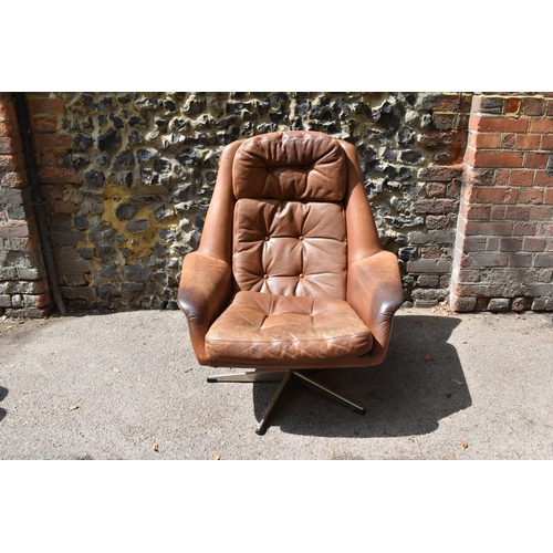 164 - A 1960s brown leather swivel chair and ottoman, probably by H.M Klein for Bramin Møbler, 88 cm high ... 