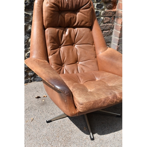 164 - A 1960s brown leather swivel chair and ottoman, probably by H.M Klein for Bramin Møbler, 88 cm high ... 