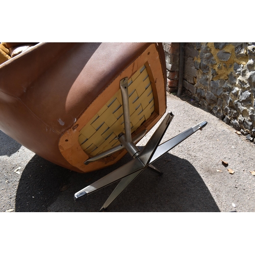 164 - A 1960s brown leather swivel chair and ottoman, probably by H.M Klein for Bramin Møbler, 88 cm high ... 