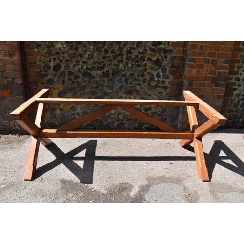 170 - A mid century pine and oak x-frame refectory table, of rectangular form with trestle base, the top s... 