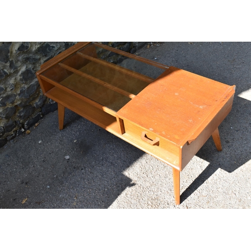 171 - A mid century G-plan E. Gomme Brandon glass topped teak coffee table, with pull through drawer, supp... 