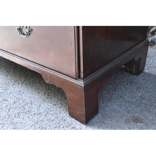 210 - A George III mahogany chest on chest, with moulded cornice, chamfered reeded corners, with three sho... 