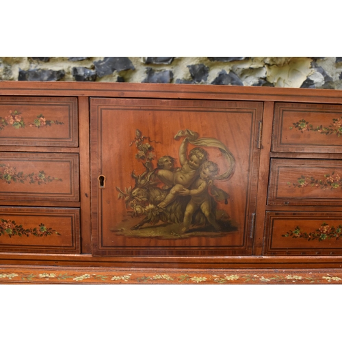 212 - An Edwardian satinwood Carlton House desk, in the Sheraton style, with leather writing surface, flan... 