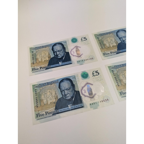 263 - A group of four British polymer £5/five pound notes to include AA01, AE10, AK47 000 and AK47 065