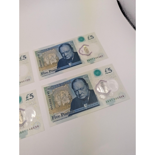 263 - A group of four British polymer £5/five pound notes to include AA01, AE10, AK47 000 and AK47 065