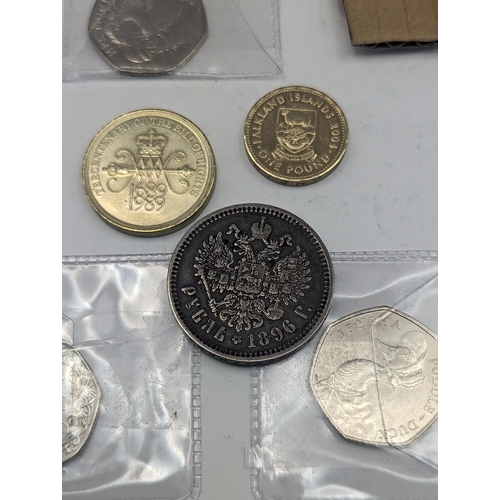 265 - A mixed collection of coins to include Beatrix Potter 50 pence, Paddington and others along with a m... 