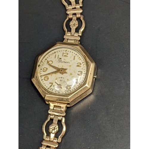 19 - A Ladies Pioneer 9ct gold manual wind watch on a 9ct gold bracelet, weight 14.1g Location:CAB1