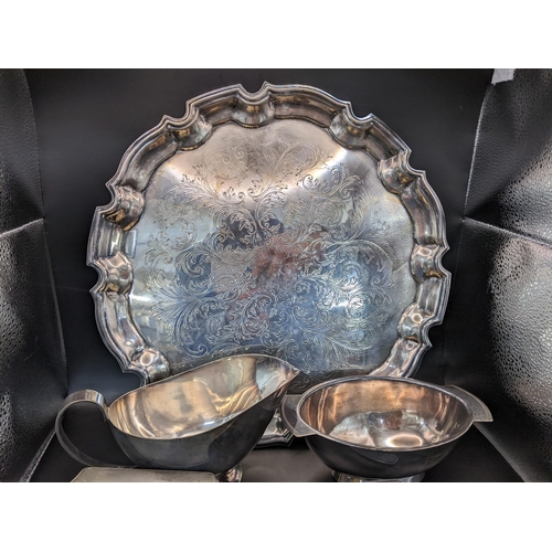 35 - Mixed silver plate to include an engraved tray, together with a silver three piece dressing table se... 