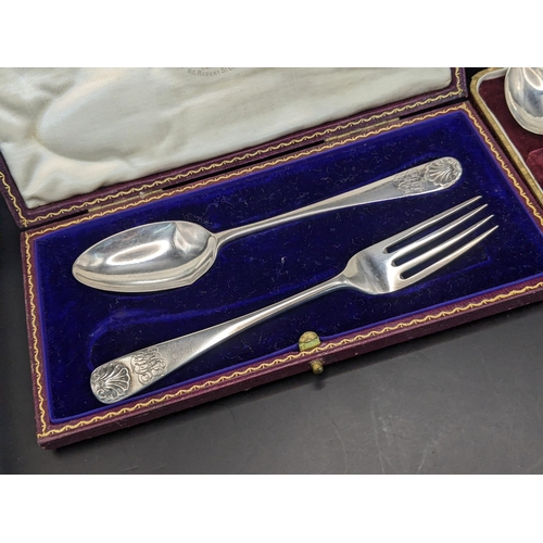 58 - Silver to include a shell terminal fork and spoon and a set of six teaspoons, initialled, total 144g... 