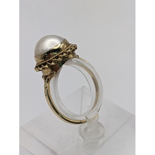 83 - THIS LOT IS WITHDRAWN
A 9ct gold Mabe pearl set ring 2.9g Location:CAB3