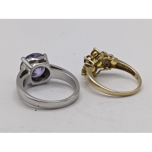 85 - THIS LOT IS WITHDRAWN
Two rings to include a 9ct gold yellow sapphire cluster ring 2.6g, and a rolle... 