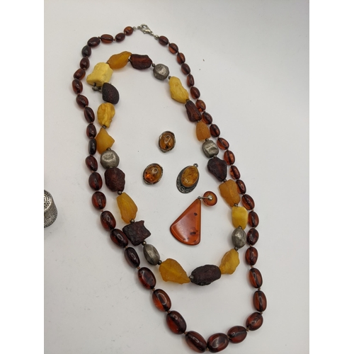 96 - A mixed lot to include an amber bead necklace and others, together with mixed silver thimbles to inc... 