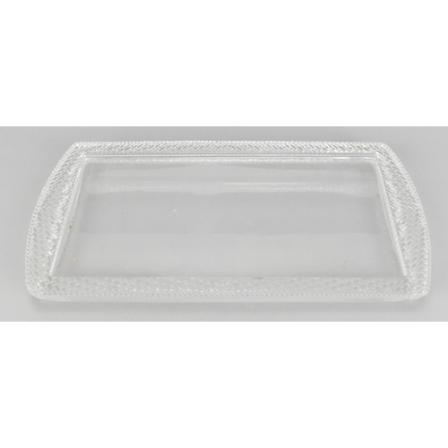 106 - A Lalique clear glass rectangular tray, post 1980, with woven pattern border, the underside with etc... 