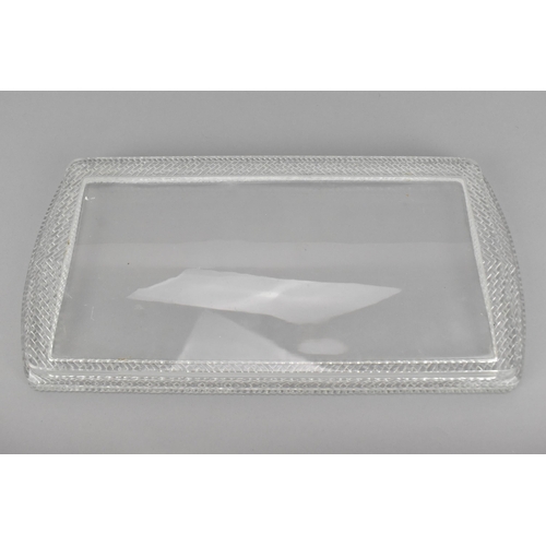 106 - A Lalique clear glass rectangular tray, post 1980, with woven pattern border, the underside with etc... 