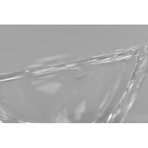 130 - A Swedish Orrefors glass bowl, with etched signature to underside, 20.5 cm wide, together with two S... 