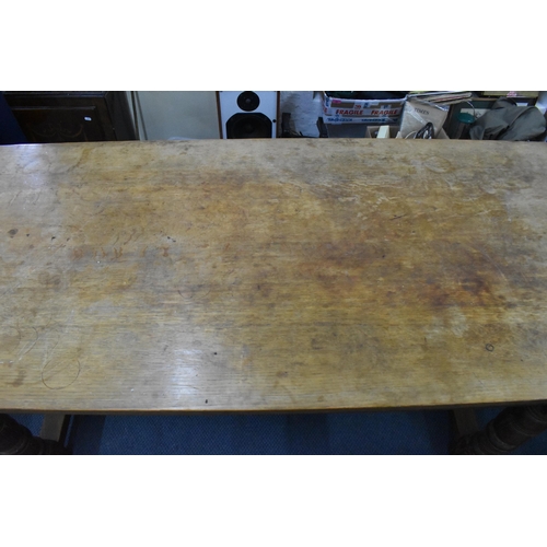 205 - A 20th century limed oak farm table, possibly by Heals, 74.5 cm high x 168 cm long x 75 cm wide