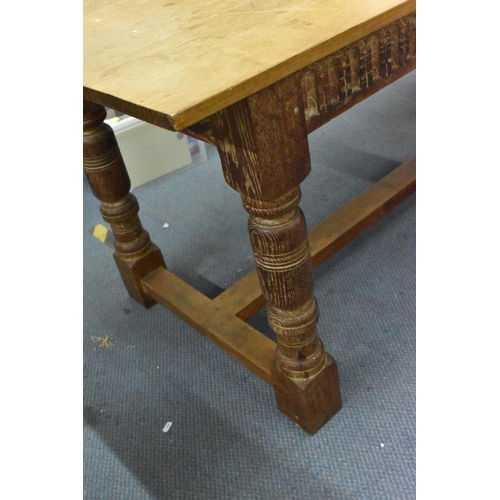 205 - A 20th century limed oak farm table, possibly by Heals, 74.5 cm high x 168 cm long x 75 cm wide