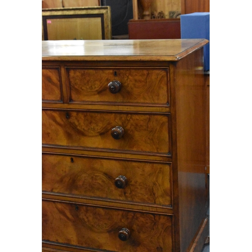 213 - A Howard & Sons Victorian walnut chest of drawers, designed with two short drawers over three long, ... 